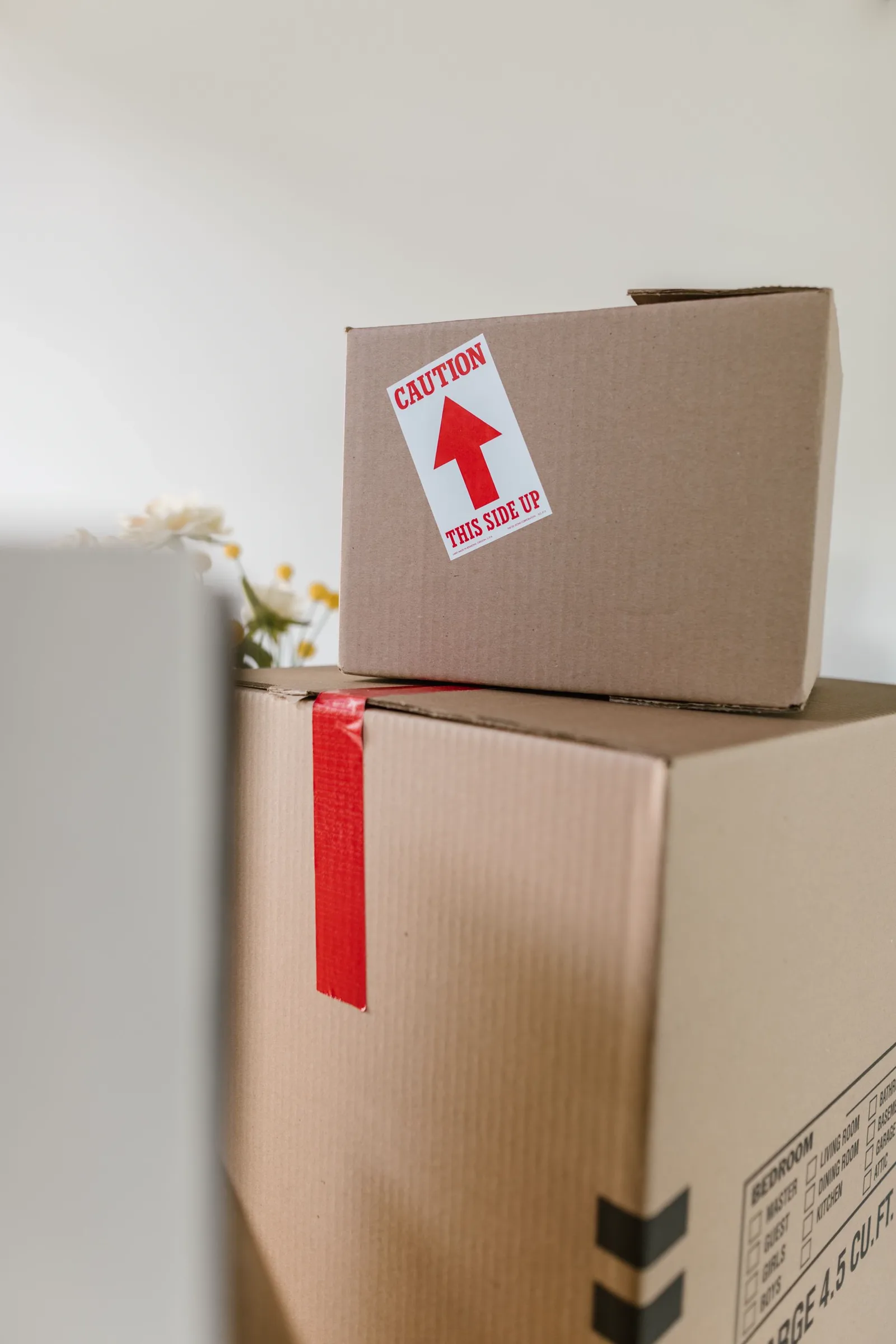 Cardboard shipment boxes carrying visible handling labels