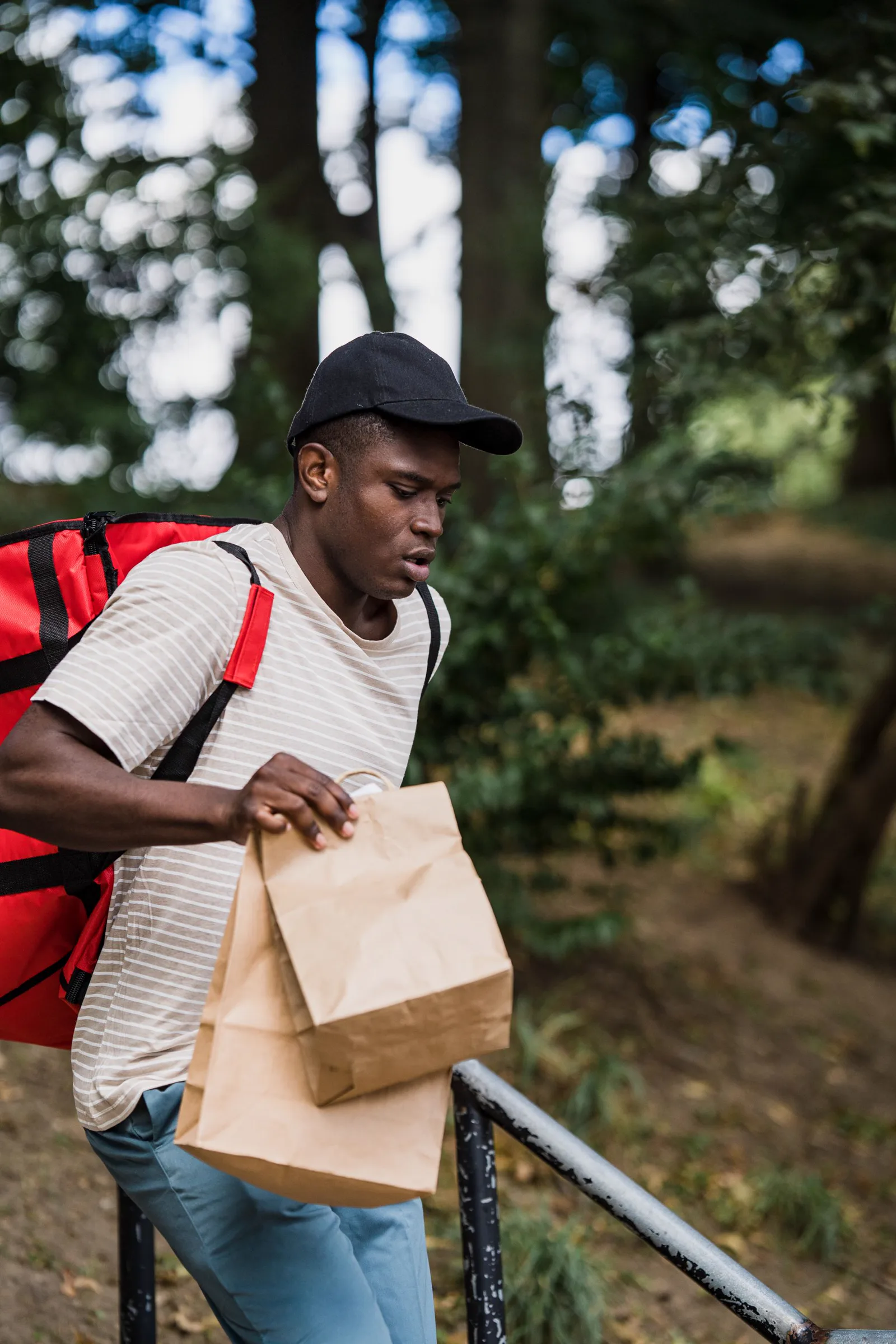 A courier carrying small parcels for cross-border delivery