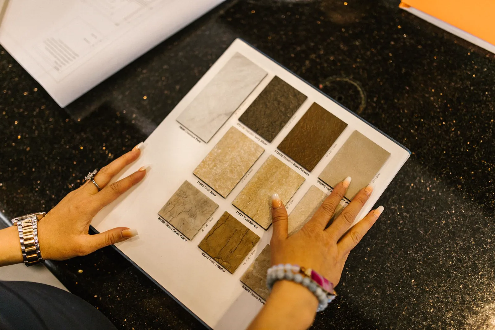 A professional reviewing product material samples in an office