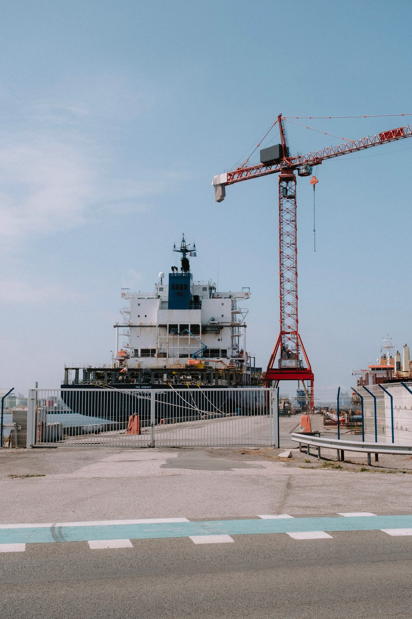 A cargo ship and port crane prepared for international transport