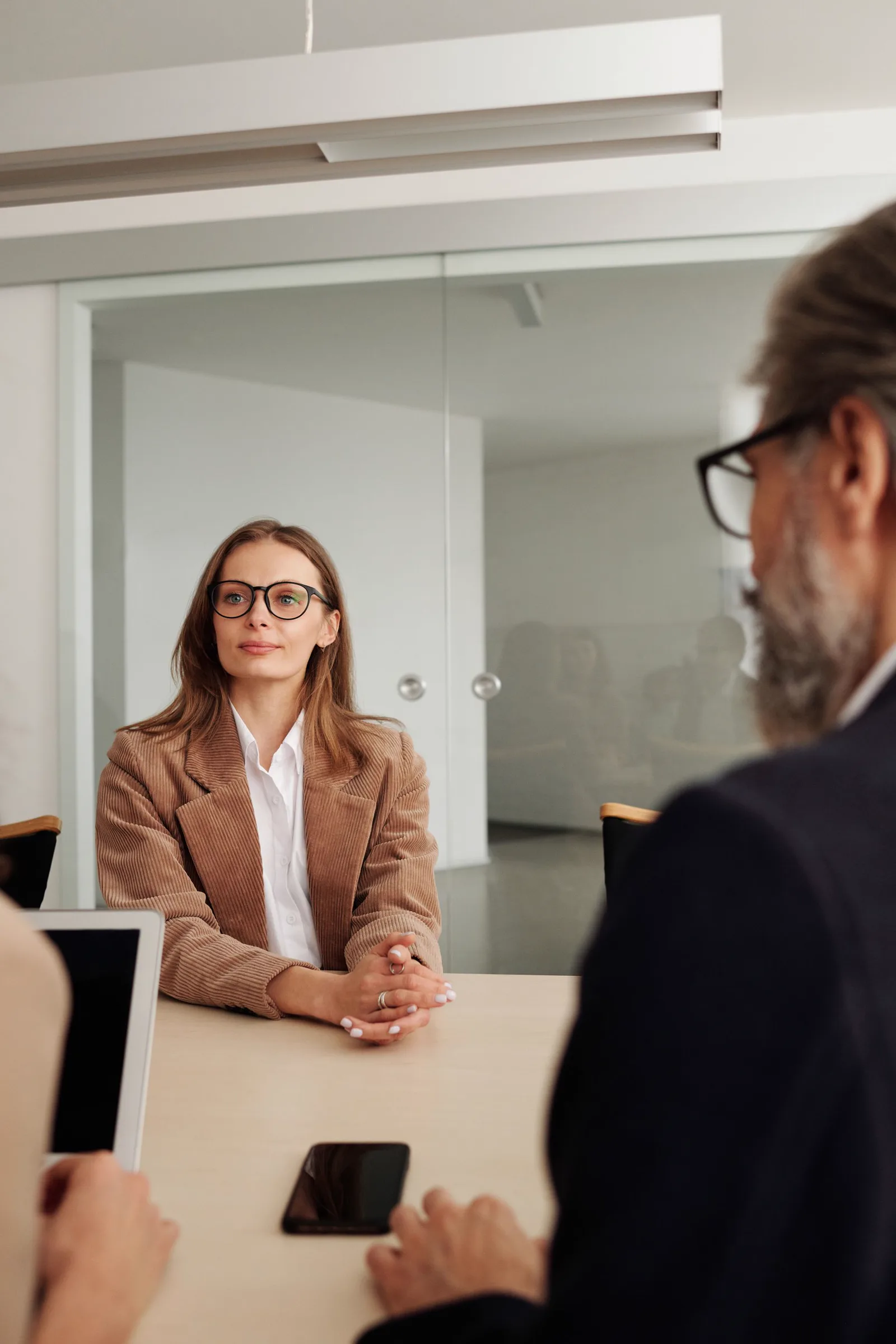 Professionals discussing a sourcing brief and next business decision
